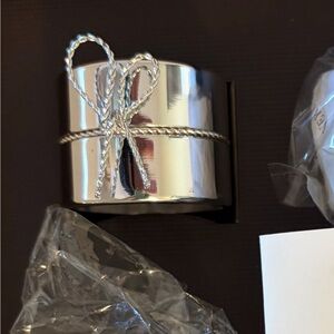 NIB-Vera Wang silver plated napkin rings. Set of 12. Selling as a set only.